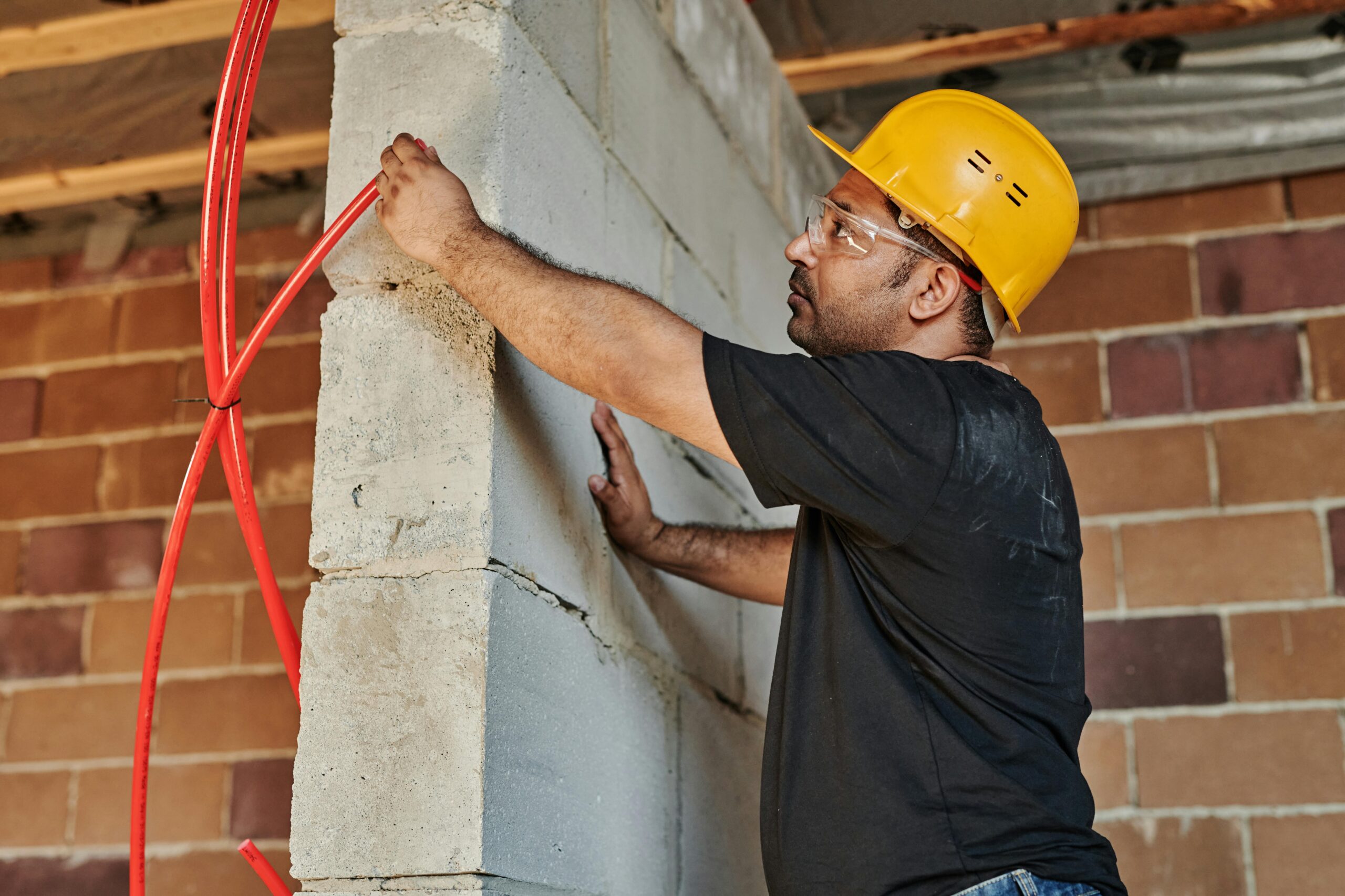 Commercial electrician inspecting electrical code violations for an Orange County property.