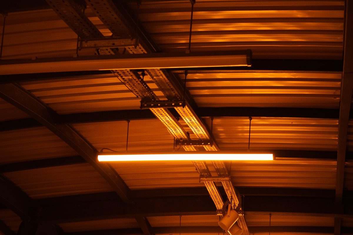 LED high bay lighting illuminating a commercial warehouse interior